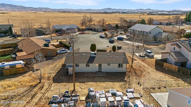 birds eye view of property with a mountain view