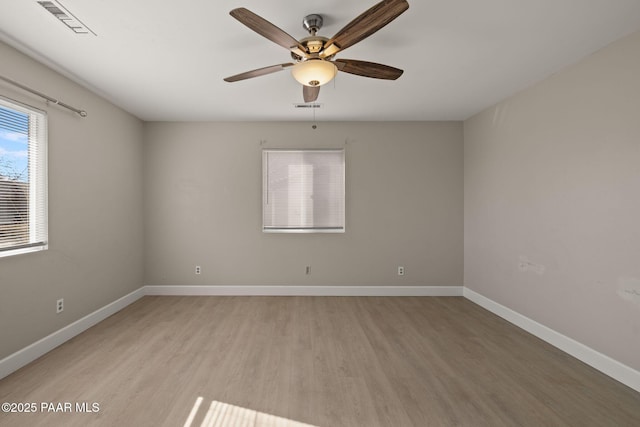 unfurnished room with ceiling fan and light hardwood / wood-style flooring