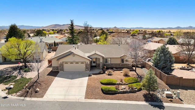 7300 Butte Vis, Prescott Valley, AZ 86315 - single story home with driveway, a mountain view, fence, and an attached garage