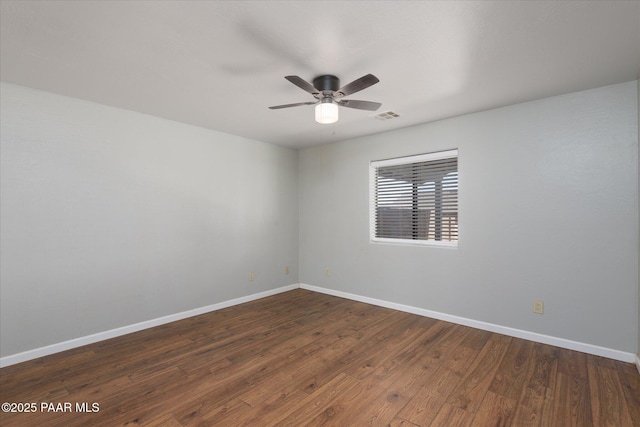 13819 S Bluebird Ln, Mayer, AZ 86333 - unfurnished room featuring dark wood-style floors and ceiling fan
