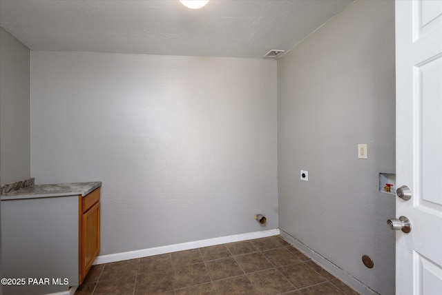 13819 S Bluebird Ln, Mayer, AZ 86333 - laundry area with hookup for an electric dryer, hookup for a washing machine, and cabinet space