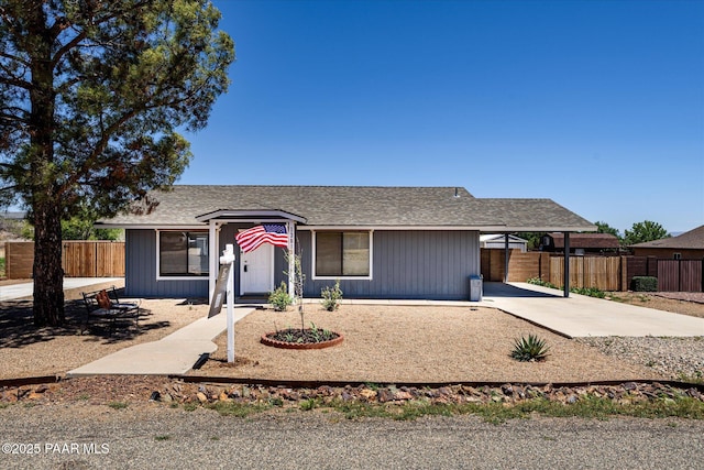 13819 S Bluebird Ln, Mayer, AZ 86333 - single story home featuring an attached carport, driveway, and a shingled roof