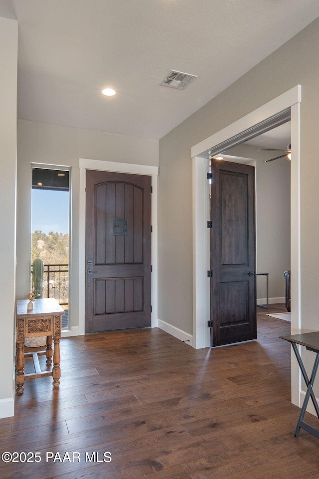 foyer with dark hardwood / wood-style floors