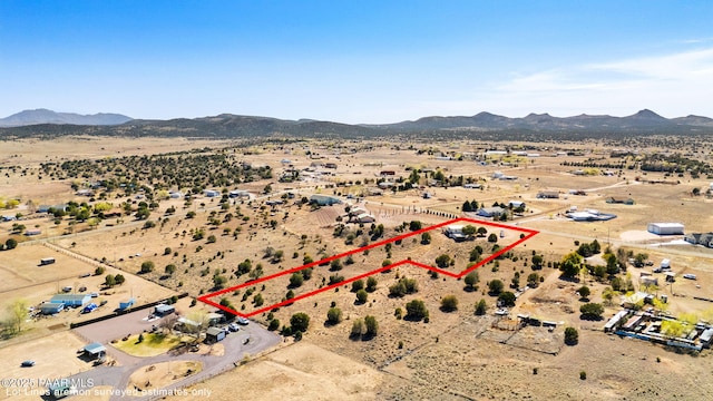 aerial view with a rural view, a mountain view, and a desert view