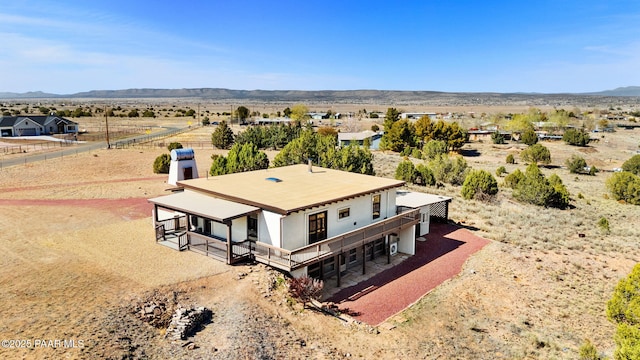 aerial view featuring a rural view, a mountain view, and a desert view