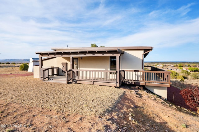 view of front of house featuring stucco siding