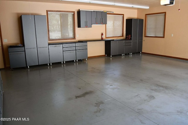 1284 Mcdonald Dr, Prescott, AZ 86303 - garage featuring baseboards and a garage door opener