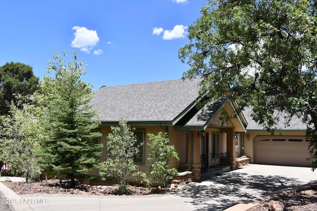 1284 Mcdonald Dr, Prescott, AZ 86303 - view of front of property featuring an attached garage, driveway, and a shingled roof