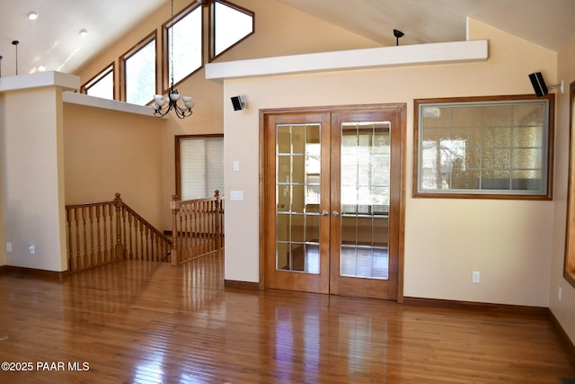 1284 Mcdonald Dr, Prescott, AZ 86303 - unfurnished room featuring french doors, wood finished floors, and vaulted ceiling