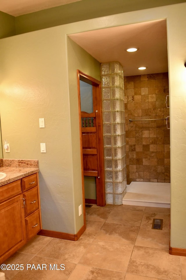 1284 Mcdonald Dr, Prescott, AZ 86303 - full bathroom featuring vanity, a tile shower, recessed lighting, and tile patterned flooring