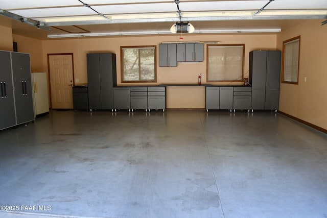1284 Mcdonald Dr, Prescott, AZ 86303 - garage featuring a garage door opener and baseboards