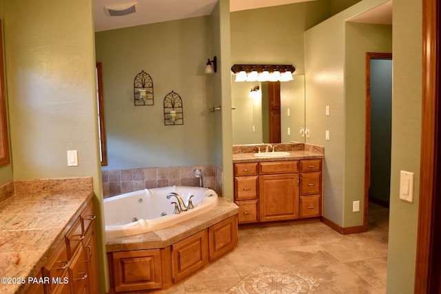 1284 Mcdonald Dr, Prescott, AZ 86303 - bathroom with vanity, a jetted tub, and tile patterned flooring