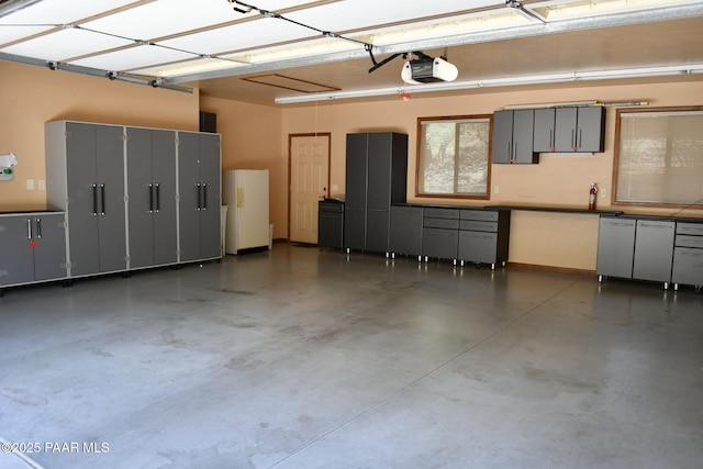 1284 Mcdonald Dr, Prescott, AZ 86303 - garage featuring a garage door opener and baseboards