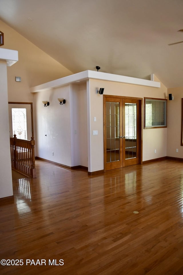 1284 Mcdonald Dr, Prescott, AZ 86303 - unfurnished room with wood finished floors, french doors, high vaulted ceiling, and ceiling fan