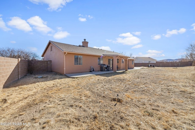 rear view of house featuring a patio area