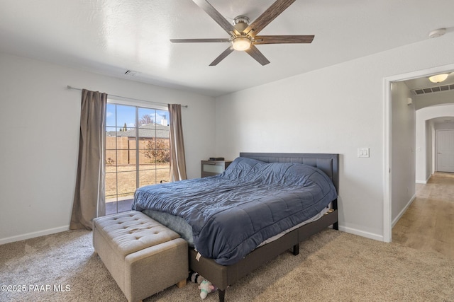 bedroom featuring ceiling fan and light carpet