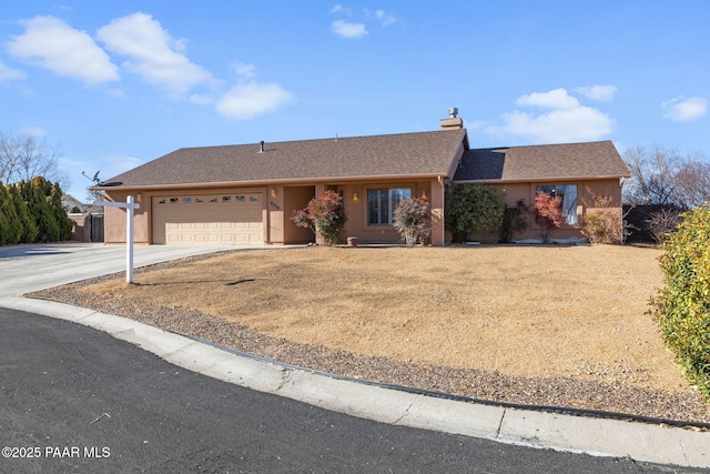 ranch-style home featuring a garage