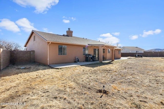 back of property featuring a patio area