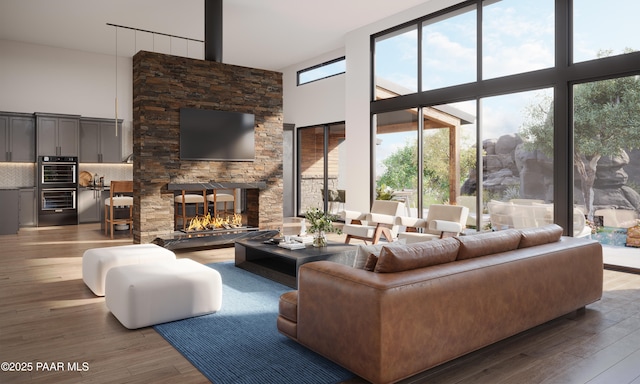 4333 N Twisted Trl, Prescott, AZ 86301 - living room featuring a high ceiling, wood finished floors, and a fireplace