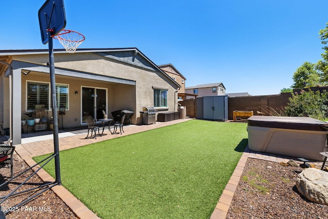 6214 Harvest Moon Ave, Prescott, AZ 86305 - back of property with stucco siding, a fenced backyard, a shed, and a patio