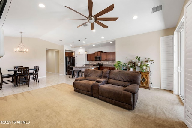 6214 Harvest Moon Ave, Prescott, AZ 86305 - living room featuring a ceiling fan, a chandelier, light colored carpet, vaulted ceiling, and light tile patterned floors
