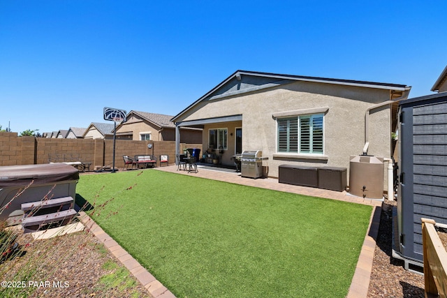 6214 Harvest Moon Ave, Prescott, AZ 86305 - back of house featuring stucco siding, a fenced backyard, a patio, and a hot tub