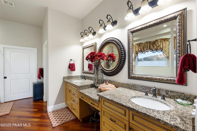 791 N Creekside Dr, Prescott, AZ 86303 - bathroom featuring two vanities and wood finished floors