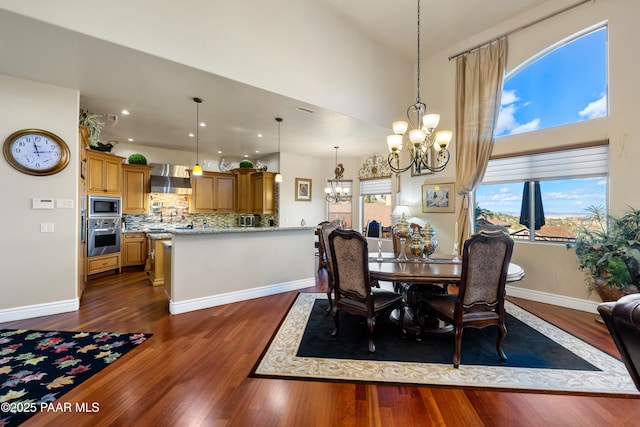 791 N Creekside Dr, Prescott, AZ 86303 - dining room featuring a chandelier, dark wood finished floors, healthy amount of natural light, recessed lighting, and a towering ceiling