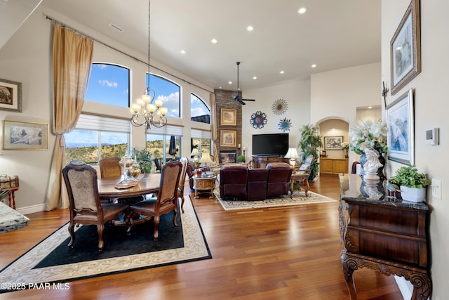 791 N Creekside Dr, Prescott, AZ 86303 - dining room featuring a high ceiling, recessed lighting, a ceiling fan, wood finished floors, and arched walkways