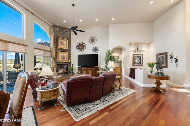 791 N Creekside Dr, Prescott, AZ 86303 - living area with a high ceiling, arched walkways, a ceiling fan, recessed lighting, and wood finished floors