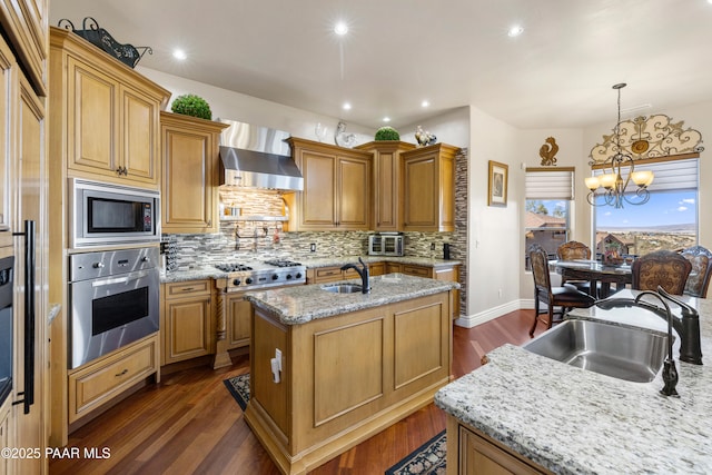 791 N Creekside Dr, Prescott, AZ 86303 - kitchen with stainless steel appliances, a kitchen island with sink, tasteful backsplash, a chandelier, and light stone countertops