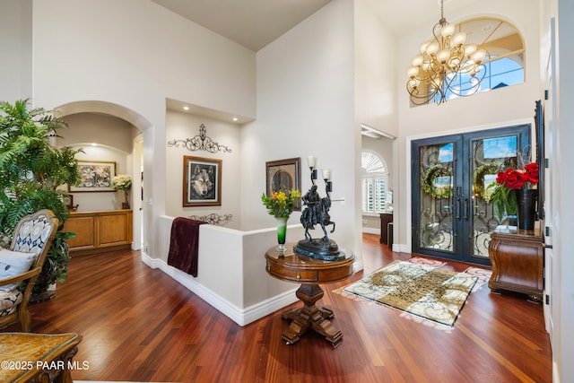 791 N Creekside Dr, Prescott, AZ 86303 - entryway with a towering ceiling, french doors, wood finished floors, a chandelier, and arched walkways