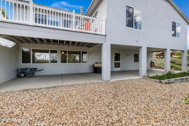 back of house with a patio area