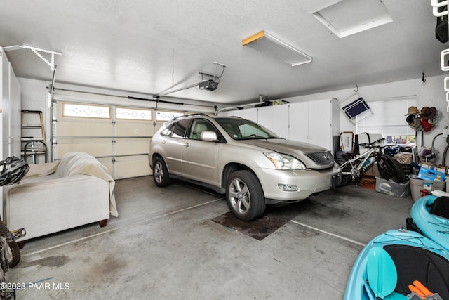 garage featuring a garage door opener