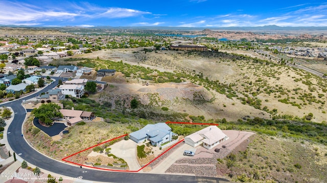 birds eye view of property with a mountain view