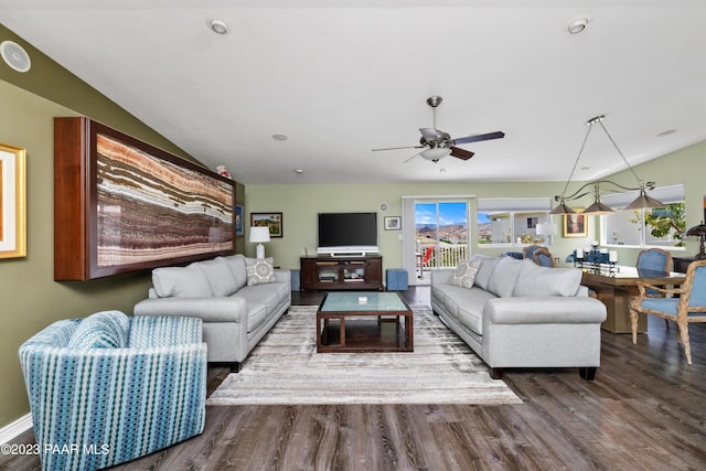 living room featuring ceiling fan and hardwood / wood-style flooring