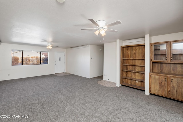 7869 Spouse Dr, Prescott Valley, AZ 86314 - unfurnished living room with a ceiling fan and carpet
