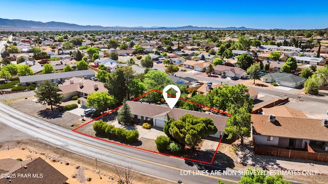 7869 Spouse Dr, Prescott Valley, AZ 86314 - aerial perspective of suburban area with property parcel outlined and a mountainous background