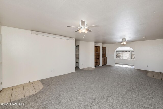 7869 Spouse Dr, Prescott Valley, AZ 86314 - unfurnished living room with ceiling fan and light carpet