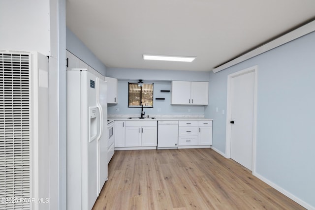 7869 Spouse Dr, Prescott Valley, AZ 86314 - kitchen with white appliances, a heating unit, white cabinetry, and light wood-type flooring