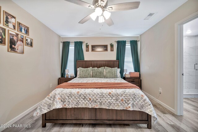 bedroom featuring ceiling fan and light hardwood / wood-style floors