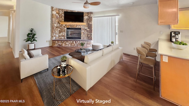 941 Custer Ln, Prescott, AZ 86305 - living area with a ceiling fan, wood finished floors, a fireplace, and baseboards