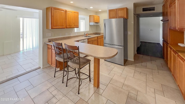 941 Custer Ln, Prescott, AZ 86305 - kitchen with freestanding refrigerator, a sink, light countertops, recessed lighting, and a peninsula