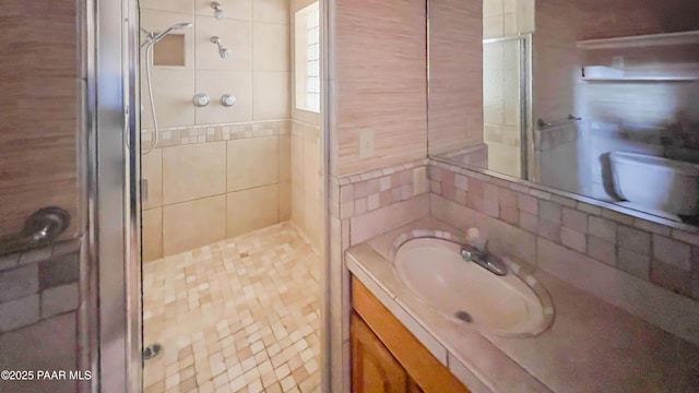 941 Custer Ln, Prescott, AZ 86305 - bathroom with a stall shower, vanity, and decorative backsplash