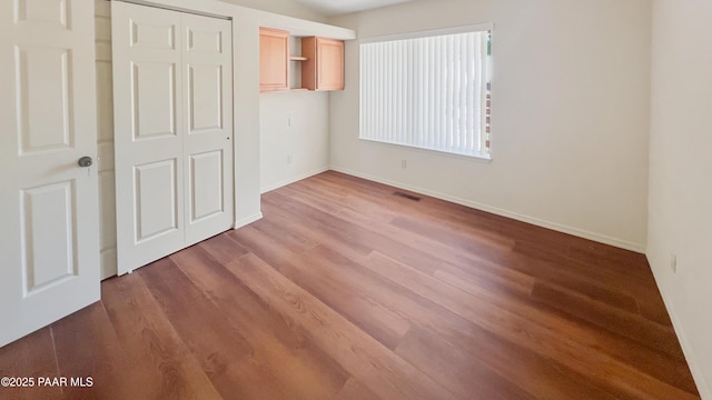 941 Custer Ln, Prescott, AZ 86305 - unfurnished bedroom featuring wood finished floors, a closet, and baseboards