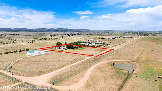 3900 W Runway Rd, Paulden, AZ 86334 - aerial view of sparsely populated area featuring property parcel outlined and a mountainous background