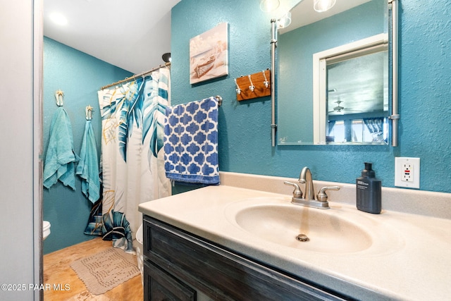 3900 W Runway Rd, Paulden, AZ 86334 - full bathroom with vanity, a textured wall, and a shower with shower curtain