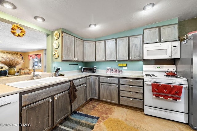 3900 W Runway Rd, Paulden, AZ 86334 - kitchen featuring white appliances, light countertops, and a textured ceiling