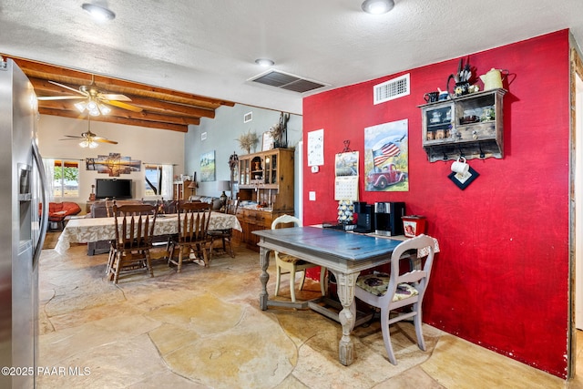 3900 W Runway Rd, Paulden, AZ 86334 - dining area with ceiling fan, a textured ceiling, beam ceiling, and stone finish floors