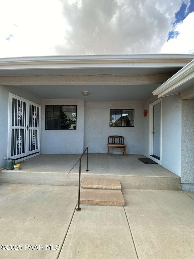 1350 W Justray Ranch Rd, Chino Valley, AZ 86323 - doorway to property with stucco siding and a porch